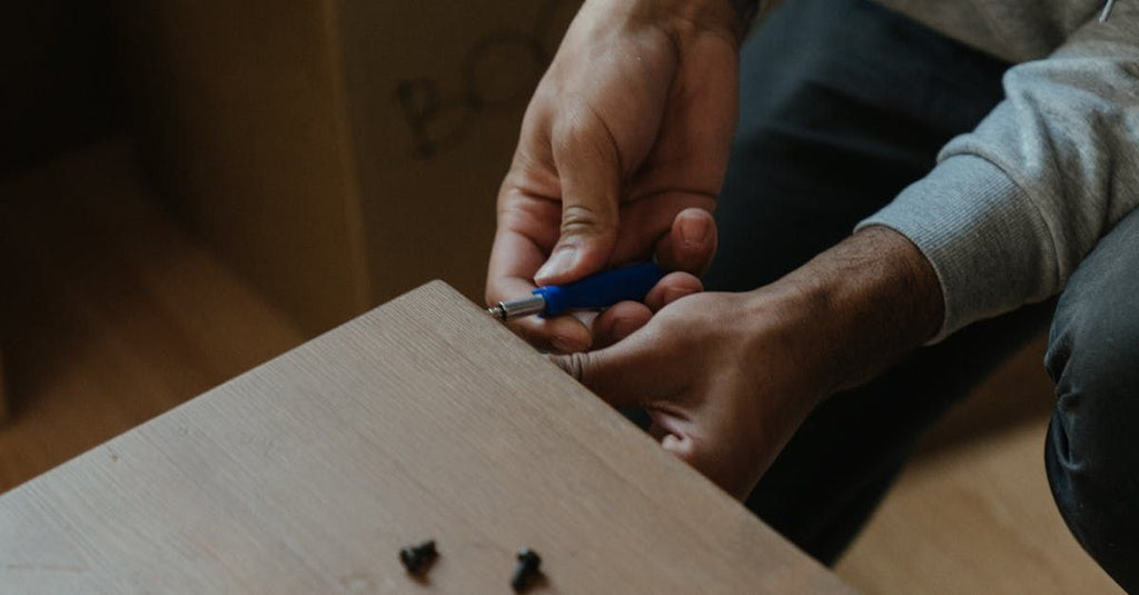 Man preparing semen sample kit at home with 'Sample Accuracy' text visible